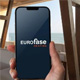 hand holding smart phone with eurofase logo on it